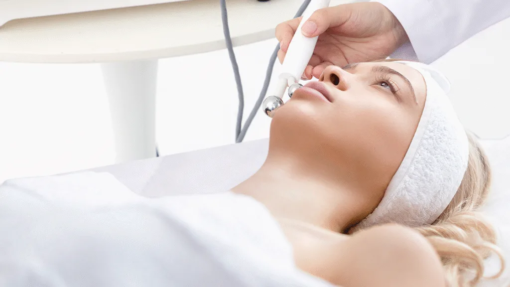 RF therapy device applied to lower face, demonstrating non-surgical reduction of marionette lines